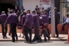 Pallbearers carry a coffin into a funeral service in Leonora.