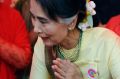 Myanmar State Counsellor and Foreign Minister Aung San Suu kyi, right, pays respect to a monk during a ceremony at ...