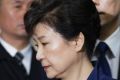 Ousted South Korean President Park Geun-hye arrives at the Seoul Central District Court for hearing on a request for her ...