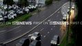 Woman runs for her life as truck veers off slippery Sydney road