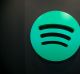 A Spotify Ltd. logo sits on display inside the music streaming company's offices in Berlin, Germany, on Friday, June 17, ...
