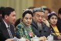 Delegates from Xinjiang attend the Xinjiang group meeting at the Great Hall Of The People in Beijing on March 12.