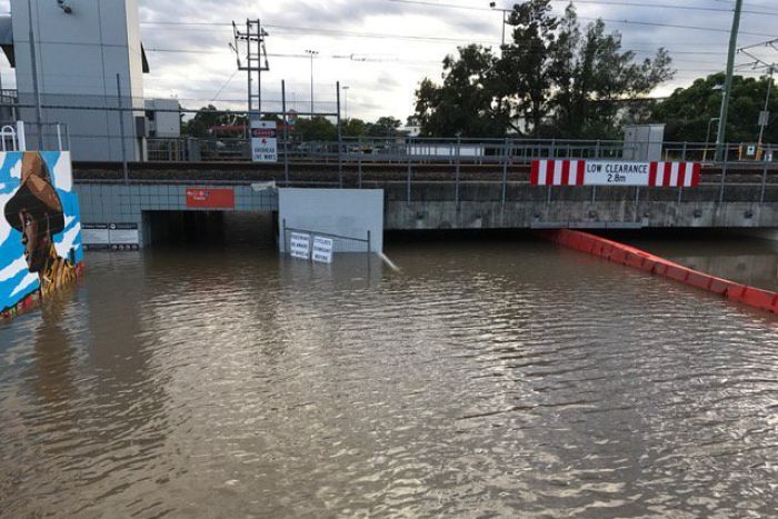 The flood waters approach a bridge reading 2.8 metres