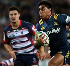 White-line fever: Malakai Fekitoa heads for the try line.