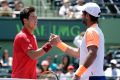 Respect: Kei Nishikori, left, and Fernando Verdasco shake hands after their marathon match.