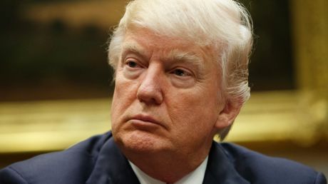 President Donald Trump listens during a meeting with the National Association of Manufacturers, Friday, March 31, 2017, ...