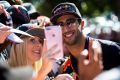 Daniel Ricciardo signs autographs and takes selfies at the Australian Formula One Grand Prix. 