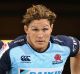 MELBOURNE, AUSTRALIA - MARCH 24: Michael Hooper of the Waratahs runs past the Weary Dunlop Shield during the round five ...