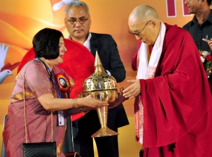 Tibetan spiritual leader Dalai Lama being felicitated with traditional Assamese Sarai at a function