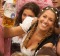 MUNICH, GERMANY - SEPTEMBER 17: Visitors hold up one-litre glasses of beer to kick off the 2016 Oktoberfest beer ...