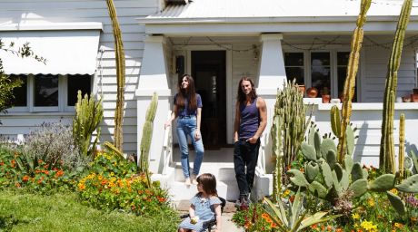 Sarah, Tabitha and Andy in their whitewashed California bungalow.
Andy planted the thriving cactus garden.