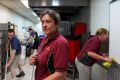 Yatala Pie's manager Heather Gay puts on a brave face with staff during flood clean up efforts on April 1. She said help ...