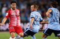 Lacking sparkle: Melbourne City's Bruno Fornaroli feels the pressure from his Sydney FC opponents in the 3-0 loss on ...