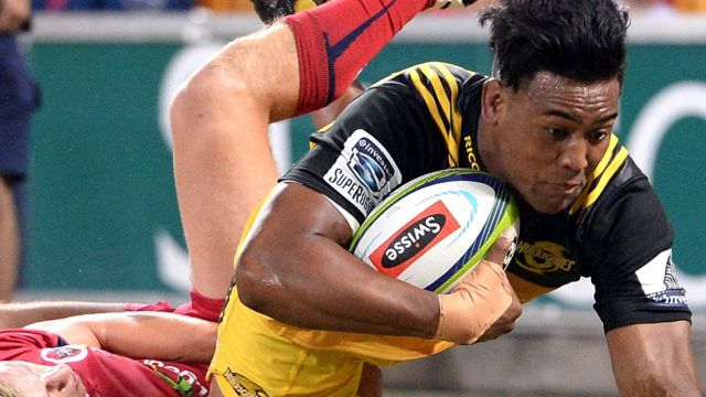 Julian Savea of the Hurricanes scores a try.