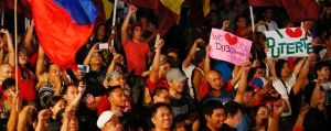 Hundreds of supporters of President Rodrigo Duterte gather at Manila's Rizal Park for an overnight vigil to show their ...