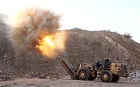 Locally made shells are launched by Free Syrian Army fighters towards the Sheikh Maqsud neighbourhood of the northern Syrian city of Aleppo