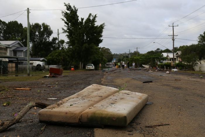 A mattress, on a road.