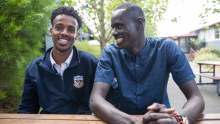 Maribyrnong College school captain Mohamed Semra (left) with teacher's aide Alor Deng.