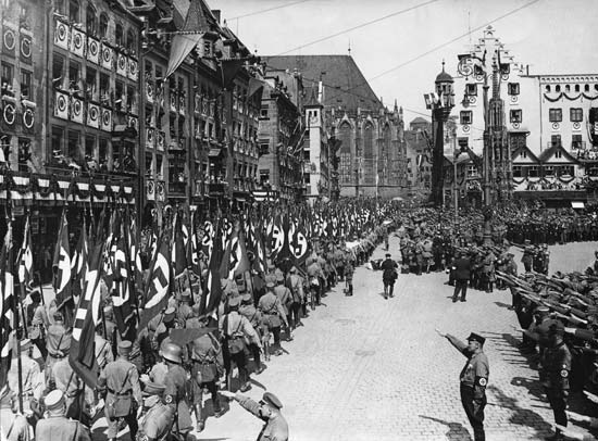 Nazi Storm Troopers marching through the streets of Nürnberg, Germany, after a Nazi Party rally.