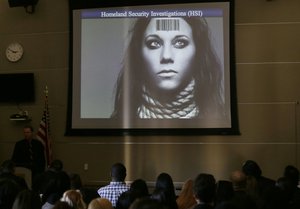 File - In this Tuesday, Jan. 12, 2016 photo, members of the industry group Club Owners Against Sex Trafficking attend a presentation by a U.S. Department of Homeland Security agent teaching owners of strip clubs and strippers how to spot sex traffickers, at the Burbank Community Services Building in Burbank, Calif.