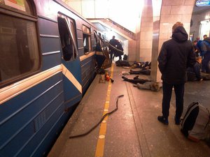 Blast victims lie near a subway train hit by a explosion at the Tekhnologichesky Institut subway station in St.Petersburg, Russia, Monday, April 3, 2017.