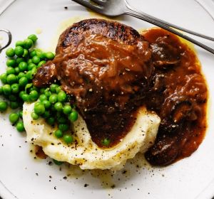 Salisbury steaks with mushroom and onion gravy.