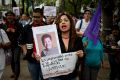 A woman shouts slogans holding a photo of Mexican journalist Miroslava Breach, gunned down in the northern state of ...