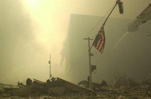 An American flag at ground zero on the evening of Sept. 11, 2001 after the September 11 terrorist attacks on the World Trade Center in New York City.