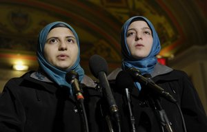 In this Thursday, Feb. 6, 2014 file photo, Heba Sawan, left, and her sister Amineh Sawan speak during a news conference on Capitol Hill in Washington.