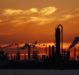 Emissions rise from an oil refinery at sunset in Texas City, Texas.