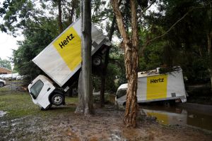 Trucks were among the large objects lifted by the floodwaters in the swollen Tweed and Wilsons Rivers.