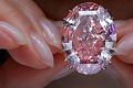 The Pink Star diamond, the most valuable cut diamond ever offered at auction, as it was displayed by a model at a ...