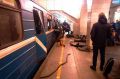 Blast victims lie near a subway train hit by a explosion at the Tekhnologichesky Institut subway station in ...