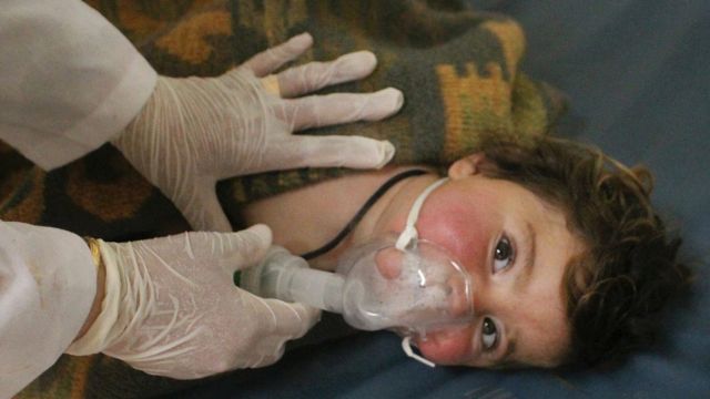 A child victim of a suspected chemical attack is treated at a makeshift hospital in the town of Khan Sheikhoun, northern ...