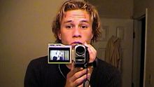 Heath Ledger records himself with a handycam.