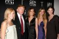 Donald Trump, Melania, and women signed to Trump Models during a viewing party for "The Apprentice 2" at Pressure in New ...