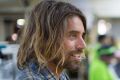 Surfer Dave Rastovich out of his comfort zone at a garment factory.