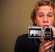 Heath Ledger records himself with a handycam.