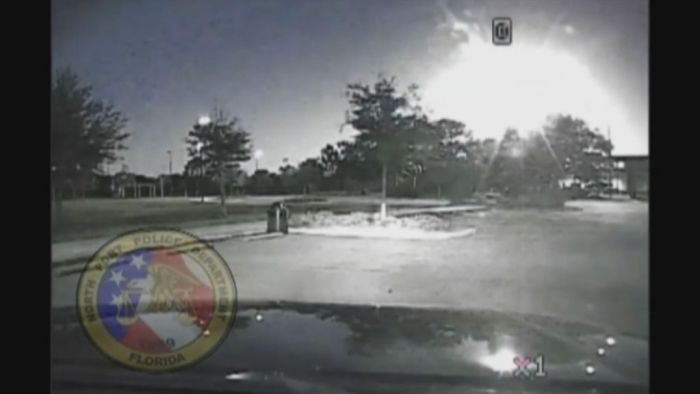 Police dashcam captures fireball blazing through night sky