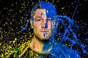 Brumbies player Kyle Godwin taking part in a paint throwing photoshoot for the season Guide. Photo Jay Cronan. Contact ...