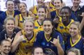 Grinners: The winning Sydney team with the 2017 WNBL grand final trophy. 