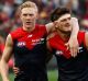 Demons Clayton Oliver (left) and Angus Brayshaw celebrate the win against Carlton last weekend.