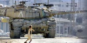 Intifada: a Palestinian boy confronts an Israeli tank