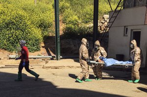 In this photo taken on Tuesday, April 4, 2017 and made available Wednesday, April 5, Turkish experts carry a victim of alleged chemical weapons attacks in Syrian city of Idlib, at a local hospital in Reyhanli, Hatay, Turkey.