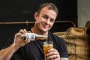 Pomeroy's Hayden Thompson pours out a tall glass of Rad Cold Brew Coffee.