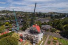 Cranes were used to lift the 17 tonne roof of the Pop-up Globe at Ellerslie Racecourse during the lead up to  opening ...