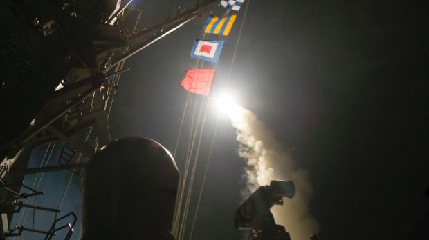 The USS Ross (DDG 71) fires a Tomahawk land attack missile from the Mediterranean Sea. 