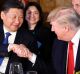 President Donald Trump, right, shakes hands with Chinese President Xi Jinping during a dinner at Mar-a-Lago.