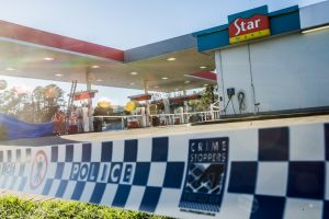 NSW police officers and SES personnel attend the scene of a fatal stabbing at the Queanbeyan Caltex service station. ...