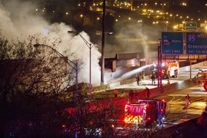 moke billows from a section of an overpass that collapsed from a large fire on Interstate 85 in Atlanta, Thursday, March 30, 2017.